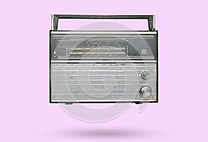 Obsolete retro radio receiver on violet pastel background. Top view