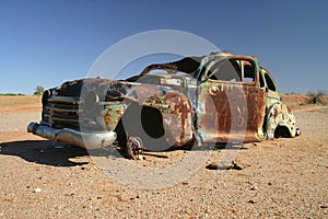 Obsolete rusted car.