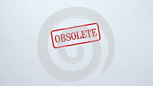 Obsolete seal stamped on blank paper background, outdated information, not valid