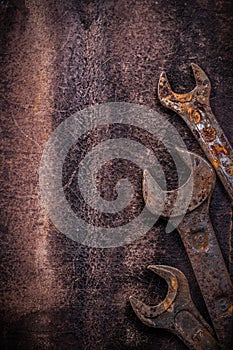 Obsolete spanner wrenches on vintage leather