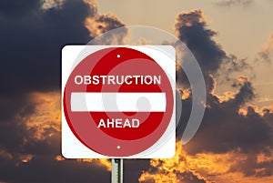 Obstruction sign with stormy clouds