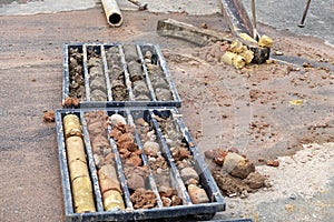 Obtaining soil samples in plastic core box