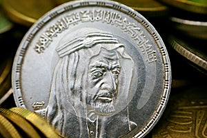 The obverse side of an Egyptian one pound coin, 1 LE coin year 1976, 1396 AH with Bust of King Faisal half right