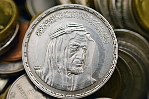 The obverse side of an Egyptian one pound coin, 1 LE coin year 1976, 1396 AH with Bust of King Faisal half right