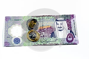 Obverse side of new polymer 5 SAR five Saudi Arabia riyals cash money banknote bill series 1441 AH features Shaybah oil refinery