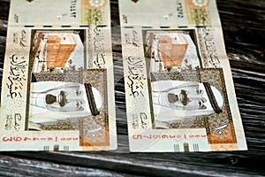 Obverse side of Saudi Arabia 10 SAR ten Saudi riyals cash money banknote with the photo of king Abdullah Bin AbdulAziz Al Saud