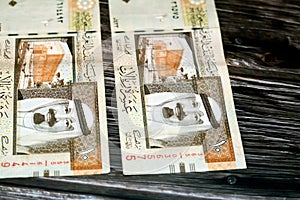 Obverse side of Saudi Arabia 10 SAR ten Saudi riyals cash money banknote with the photo of king Abdullah Bin AbdulAziz Al Saud and
