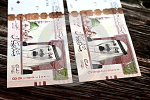 Obverse side of Saudi Arabia 100 SAR one hundred riyals cash money banknote with the photo of king Abdullah Bin AbdulAziz