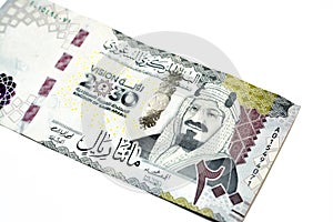 Obverse side of 200 two hundred Saudi riyals banknote features King Abdul Aziz Al Saud founder of the kingdom and a 3D logo 2030 photo