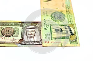 Obverse sides of 1 one Saudi Arabia riyal money banknote bills that features a portrait of king Fahd and king Abdullah