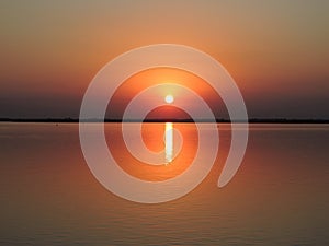 Ocaso sol, puesta de sol, en la calma de los rÃÂ­os de la Hidrovia Paraguay ParanÃÂ¡ photo