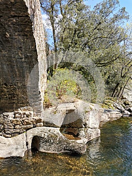 occitanie river under a stone bridge