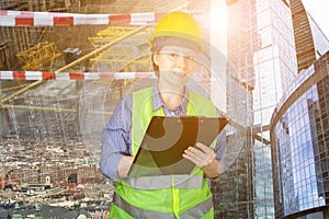 Occupational Safety and Health on construction site, builder engineer inspector in a helmet in a vest on the background of the