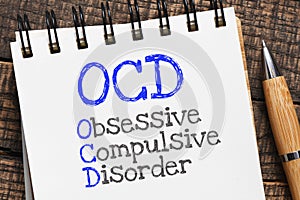 OCD Obsessive Compulsive Disorder written in notebook