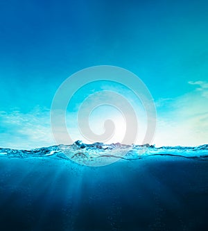 Ocean blue underwater waves with sun beam clear view realistic, world oceans day banner