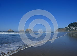 Ocean on a cloudless day with rock formations