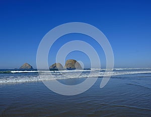 Ocean on a cloudless day with rock formations