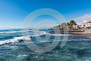 Ocean coast in the tourist resort Playa de las Americas, Tenerife island, Canary Islands, Spain photo