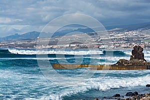 Ocean coast in the tourist resort Playa de las Americas, Tenerife island, Canary Islands, Spain photo