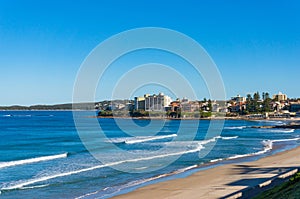 Ocean coastline with sand beach and waterfront property on the b