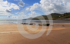 Ocean coastline in sunny day with mountains