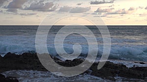 Ocean Drama: Waves Break on Reefs and Rocks at Sunset