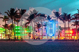 Ocean Drive Miami Beach at sunset. City skyline with palm trees at dusk. Art deco on the South beach