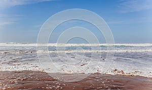 Ocean foamy waves, surf line in Morocco. Travel photography