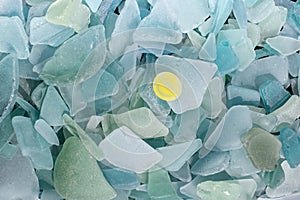 Ocean glass patterns on backgrounds with hands holding and grabbing, blues, whites, brown, green. Crafts