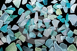 Ocean glass patterns on backgrounds with hands holding and grabbing, blues, whites, brown, green. Crafts