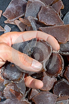 Ocean glass patterns on backgrounds with hands holding and grabbing, blues, whites, brown, green. Crafts