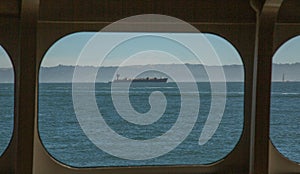 Ocean-Going Freighter as Seen Through a Ship`s Portal