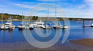 Ocean harbor in central Maine with sail boats and motor boats