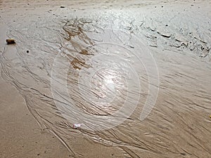 Pattern created by tide water on sand