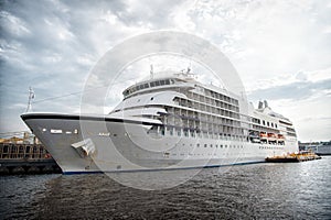 Ocean liner at sea pier in manaus, brazil. Passenger ship on cloudy sky. Sea transport and vessel. Summer vacation and holiday. Wa