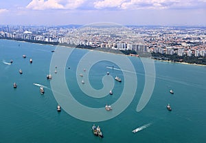 Ocean liner, tanker and Cargo Ship in Singapore Strait and Singapore city. photo
