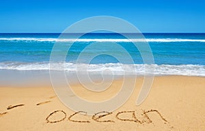 Ocean message on the beach sand