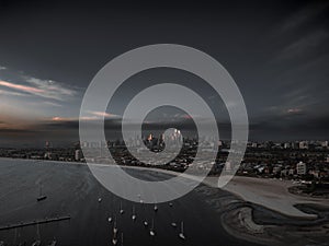 The ocean next to Melbourne city with boats during the sunset