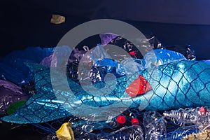 Ocean plastic pollution concept. Close-up of Mermaid, polluted habitat