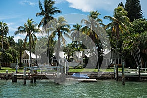 Ocean private houses with palms and piers in Miami Beach, Florida, USA.