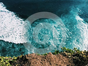 Ocean and rip curl view from abrupt cliff coast, Bali sea landscape