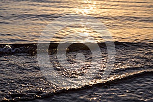 Ocean ripples at the sunset