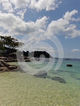 The ocean& x27;s beauty with clear blue water and big rocks