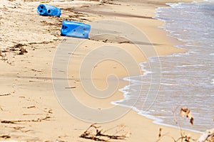 ocean or sea pollution with a washed up plastic bottle