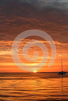 Ocean sea water. Sailing and yachting. Boat on water at sunset. Sailboats with sails.