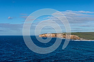 Ocean seascape with seep blue water and cliff coastline