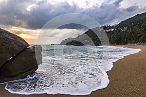 Ocean seashore with stone at sunrise in Samui island