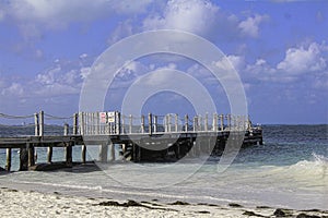 Ocean side dock on a tranquil sunny day.