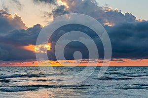 Ocean Sunset with Dramatic Dark Clouds
