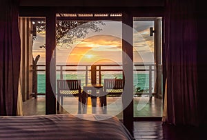 Ocean sunset view from bedroom balcony for travel concept